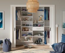 Reach in closet design for a teen's bedroom in white wood grain finish by California Closets