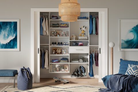 Reach in closet design for a teen's bedroom in white wood grain finish by California Closets