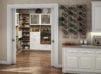 Pantry custom closet shelving system in white and light wood in extended pantry with glass doors