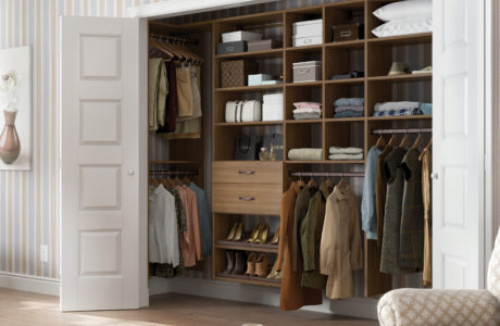 Reach in Closet with Closet Rods and Light Brown Drawers and Shelving