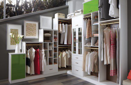White Themed Walk in Closet With Drawers Shelves Closet Rods and Apple Green Accent Cabinets