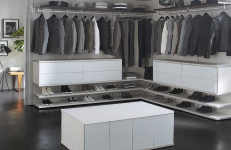 Light Grey and White Walk in Closet With Shelving Closet Rods Drawers and Storage Island