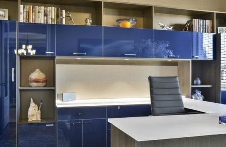 Office with High Gloss Dark Blue Cabinets High Gloss White topped Desk Wood Grain Grey Display Shelves and Built in Lighting