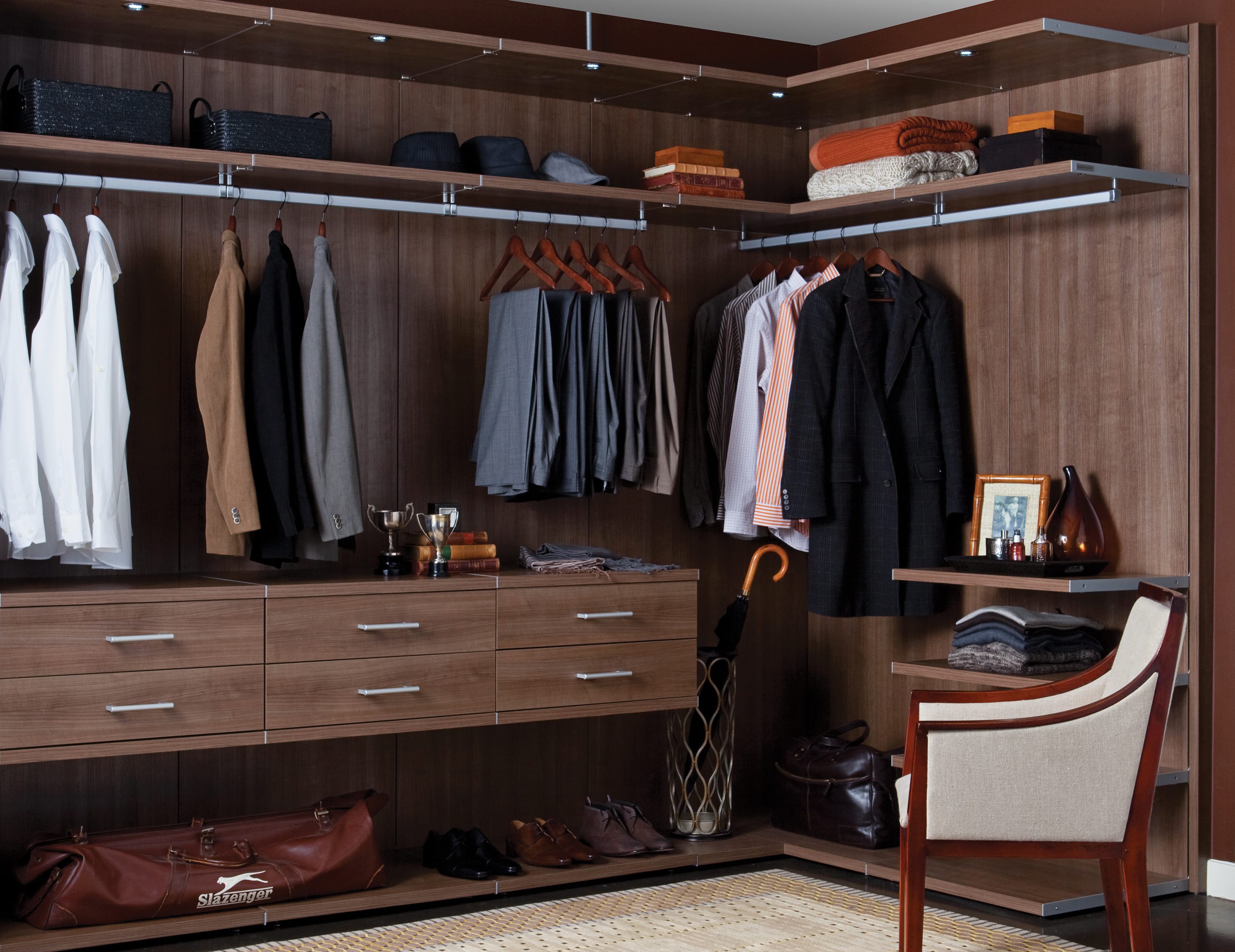 Dark Brown Wood Grain Walk in Closet with Drawers Shelves Metal Accents and Closet Rods