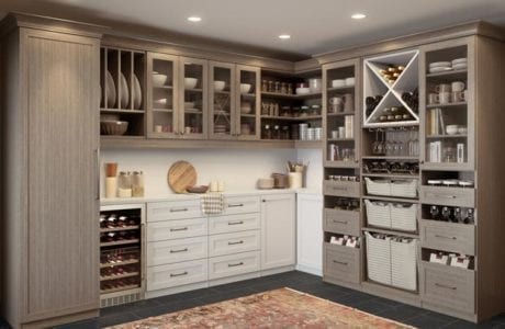 Kitchen pantry ideas inspired by customized cabinet, shelves, wine storage and countertops in a light wood grain finish by California Closets