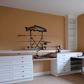 California Closets White Office Storage With Drawers Shelving Tan Counter Tops and Displayed Fishing Rods