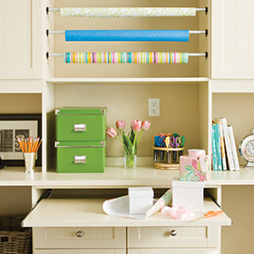 Eggshell White Craft Room with Cabinets Paper Racks and Workspace