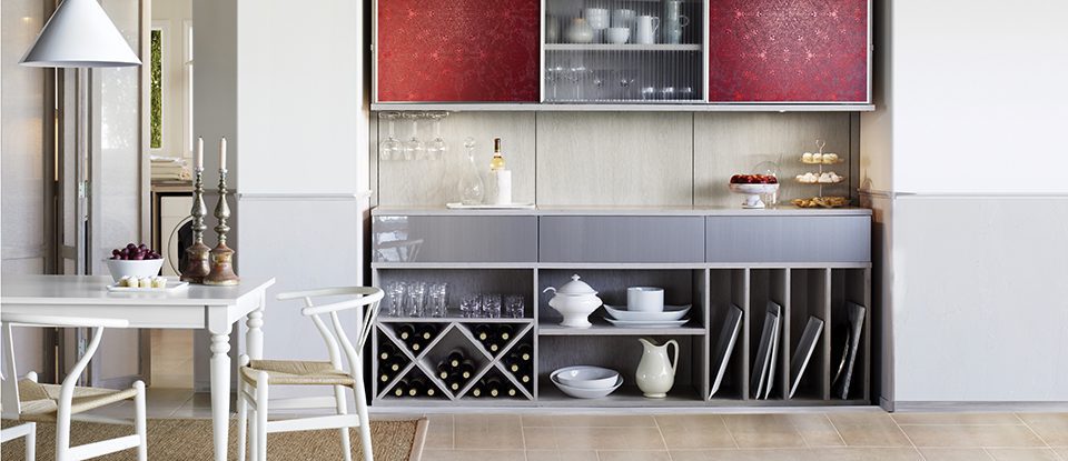 Kitchen pantry storage with cubbies, frosted glass and decorative red inlay doors and hidden spice pull out shelf