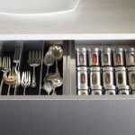Grey finish kitchen drawer with pullout spice rack storage by California Closets