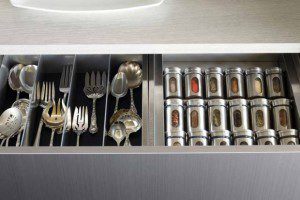 Close Up of Grey Kitchen Drawers with Flatware and Spice Organizers
