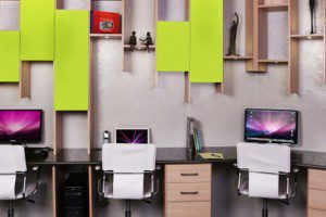 Office Space With Hanging Light Wood Shelving and Drawers High Gloss Black Desk Tops and Lime Green Accent Panels
