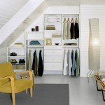 Small space reach in closet with custom shelves, drawers and hanging racks