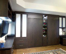 Set of Dark Brown Murphy Beds with Built in Shelving Drawers Counter Tops and Cabinets with White Inlay Accent Panels