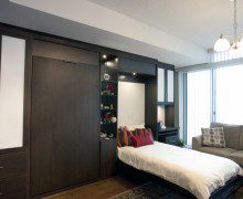 Dark Brown Murphy Bed with Built in Shelving Drawers and Cabinets with White Inlay Accent Panels