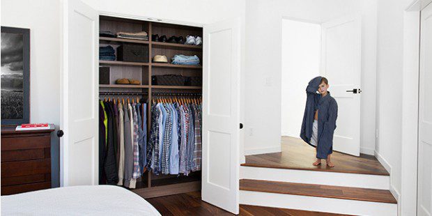 Erica Coffman Client Story Dark Brown Reach in Closet Shelving And Hanging Clothes