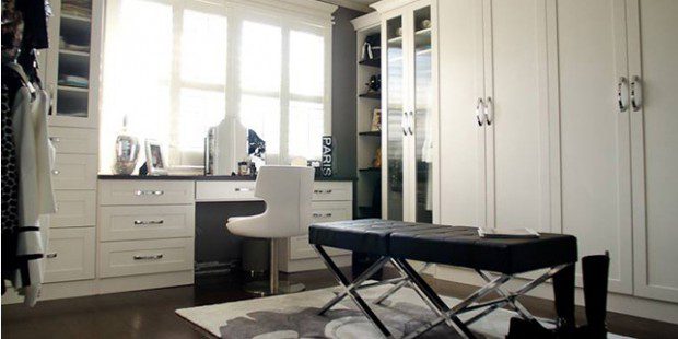 White Walk in Closet with Wardrobe Built in Desk Cabinets with Glass Doors and Black Stand Alone Bench