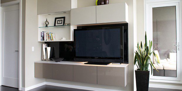 Entertainment Center With Black Backing White Shelving and Cabinets and Grey High Glass Accent Cabinets