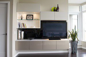 Entertainment Center With Black Backing White Shelving and Cabinets and Grey High Glass Accent Cabinets