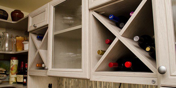 Wine storage and pantry storage in a light wood finish created by California Closets