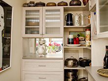 White Wood Grain Pantry With Drawers Shelving Cubbies and Etched Glass Cabinet Doors