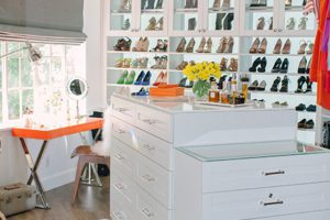 White High Gloss Walk in Closet with Shelving Cabinets With Glass Doors Tiered Stand Alone Dresser and Orange Vanity Desk