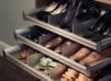 Close Up of Light Brown Pull Out Shoe Storage Drawers with Metal Accents