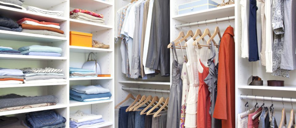 White Walk in Closet with Shelving Closet Rods and Organized Hanging Clothes