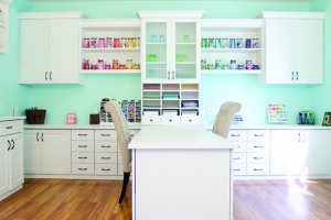 White Craft Room with Shelving Drawers Counter Space Cabinets Frosted Glass Display Doors and Built in Desk