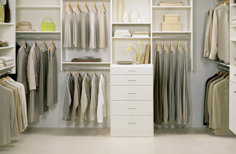 White Themed Walk in Closet with Drawers Shelving and Metal Closet Rods