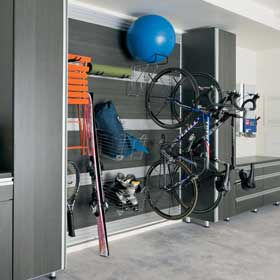 Grey Themed Garage Storage with Drawers Cabinets Hanging Racks and Metal Accents