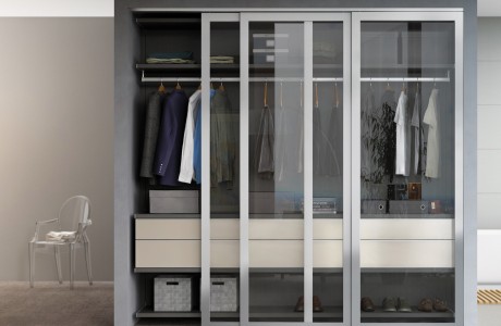 Modern closet design with shelving closet rods and drawers and sliding glass doors