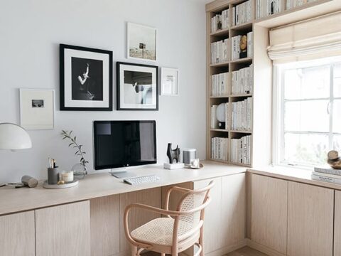 Modern Office for home in light wood grain finish custom cabinets and bookshelf California Closets.