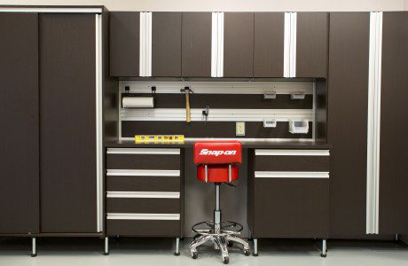 Dark Brown Garage Storage With Tool Rack Cabinets Drawers Work Space and Metal Handles