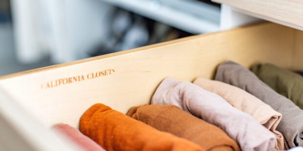 Drawer organization for intimates and tank tops in natural wood grain finish design by California Closets