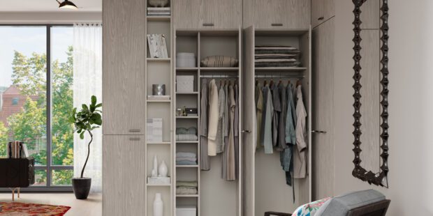 Closet organization to promote stress free storage solutions shown in light grey cabinets and shelving design by California Closets