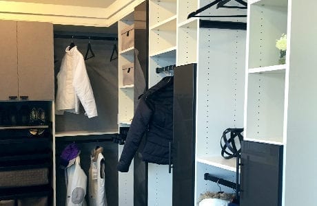 White Walk in Closet with Shelving Closet Rods and Grey and Black Cabinet Doors