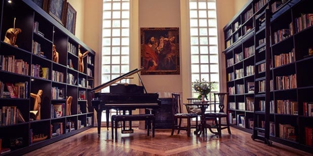 Client Story Library Redesign with Floor to Ceiling Display Shelving and Bookcases with Sliding Library Ladder