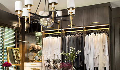 Susan Ferrier Client Story Dark Brown Walk in Closet with Flip Up Cabinets Closet Rods and Vanity Space