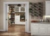 California Closets white kitchen pantry with natural light wood finish shelving