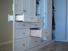 White drawers pulled out from wall cabinetry