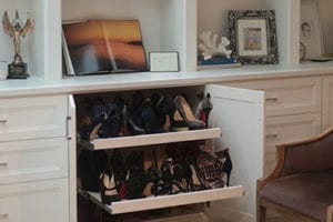 Pull out shelving revealing hidden shoe storage