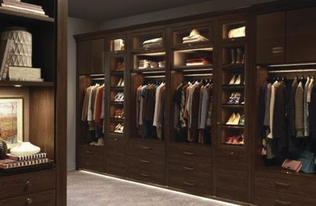 Dark Wood Walk in Closet with Cabinets Closet Rods Dresser Drawers and Display Shelving