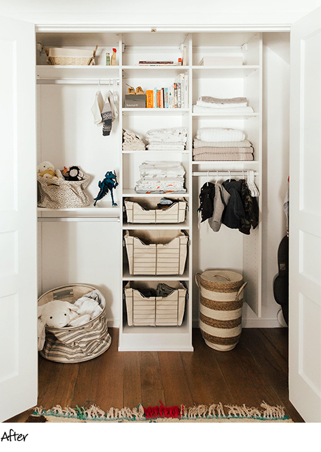 Organized reach in closet with cream colored shelving