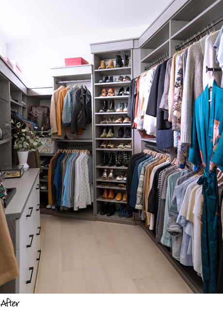 Organized clothes hanging in a renovated walk in closet with light gray shelving