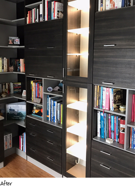 Dark gray wooden bookshelves with LED lit display shelving