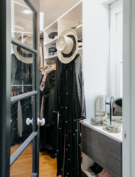 Glass door opening to California Closets client Victoria Smith's custom walk in closet