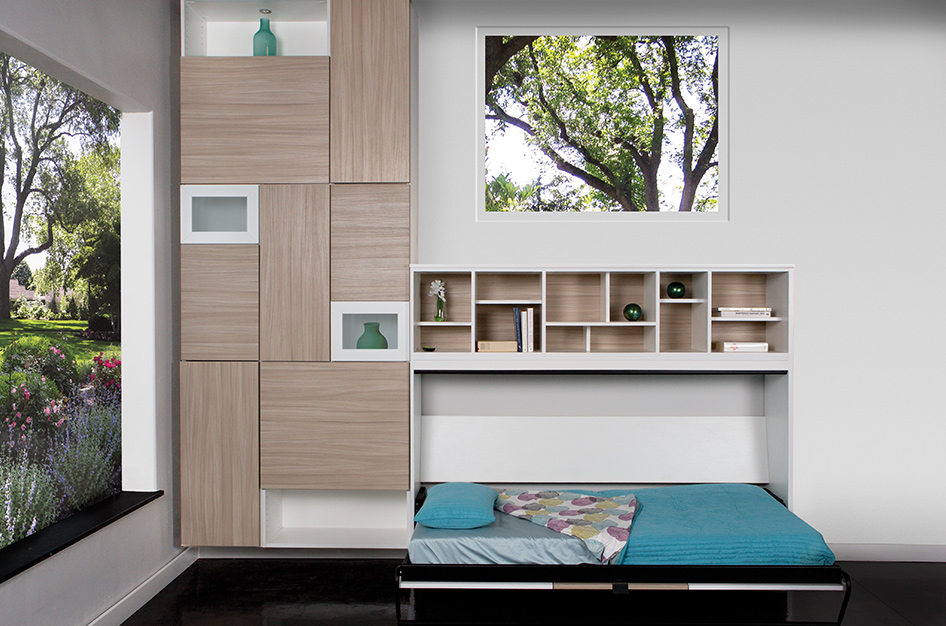 Pulled out Murphy bed with shelving space above and modern cabinetry to the side.