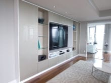 Tara Blanchet Client Story Classic White Finish Media Center with glass paneling and Recessed Accent Lighting