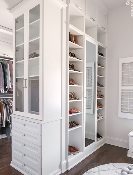 White Closet Storage Solution with Clear Glass Cabinets and Mirror Front