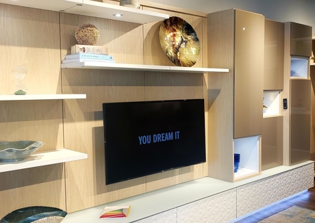 TV in wooden display unit in California Closets Showroom